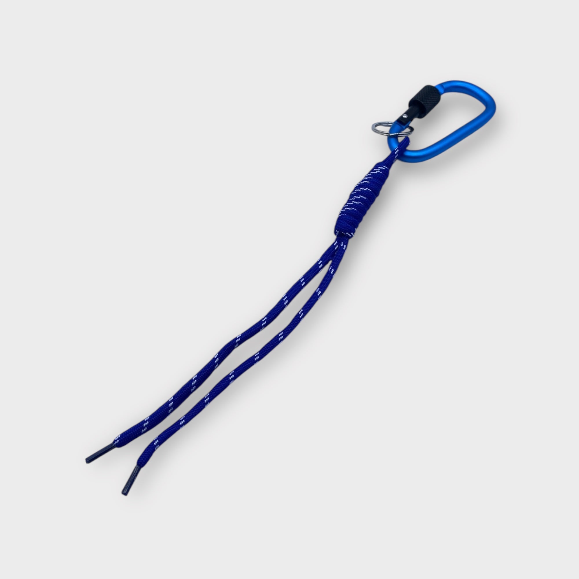 Blue shoelace with a metal lace lock on a white background