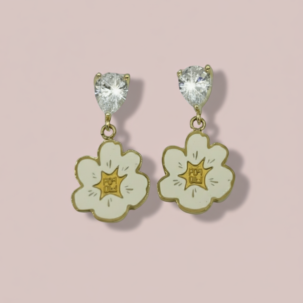 Pair of floral earrings with gold accents on a white background